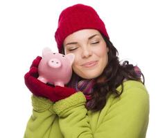 Pleased Mixed Race Woman Hugging Piggybank Isolated on White photo