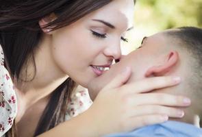 Mixed Race Romantic Couple Portrait in the Park photo