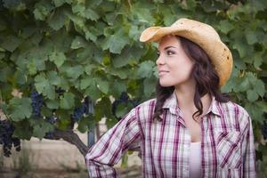 Young Adult Female Portrait Wearing Cowboy Hat in Vineyard photo