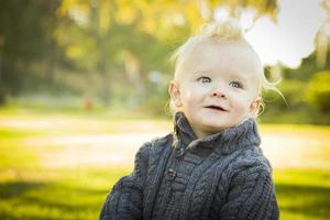 Adorable Blonde Baby Boy Outdoors at the Park photo