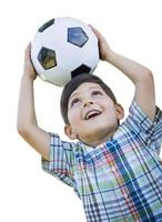 Cute Young Boy Holding Soccer Ball Isolated on White photo