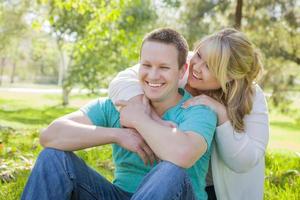 Young Attractive Couple Hugging in the Park photo