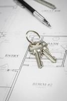 Engineer Pencil, Ruler and Keys Resting On House Plans photo