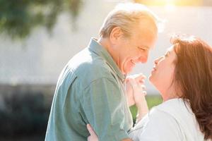 Middle Aged Couple Enjoy A Romantic Slow Dance Outside photo