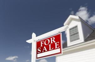 Home For Sale Real Estate Sign in Front of House photo