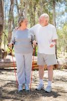 Happy Senior Couple Exercising Outside Together photo