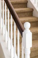 Abstract of Stair Railing and Carpeted Steps in House photo