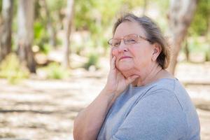 Upset Senior Woman Sitting Alone photo