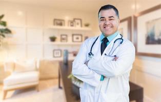 Handsome Hispanic Doctor or Nurse Standing in His Office photo