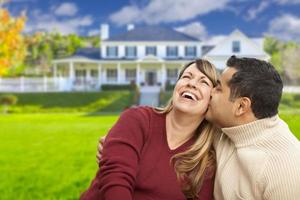 Happy Mixed Race Couple in Front of House photo