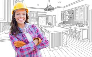 Female Construction Worker With Hard Hat, Gloves and Goggles In Front of Custom Kitchen Drawing photo