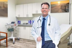 Caucasian Male Doctor Standing In Office photo