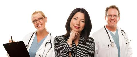 Hispanic Woman with Male Doctor and Nurse photo