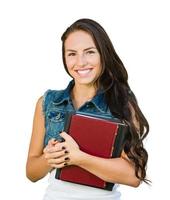 Mestizo joven estudiante con libros escolares aislado sobre fondo blanco. foto