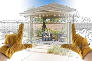 Male Contractor Hands Framing Completed Section of Custom Pergola Patio Cover Design Drawing photo