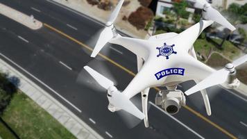 Police Unmanned Aircraft System, Drone Flying Above A City Street photo