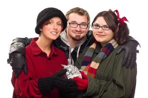 Three Friends Holding A Holiday Gift Isolated photo