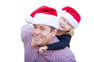 Happy Father and Daughter Wearing Santa Hats Isolated on White Background. photo