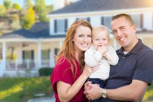 Young Military Family in Front of Their House photo