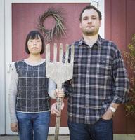 Fun Mixed Race Couple Portrait Simulating the American Gothic Painting photo