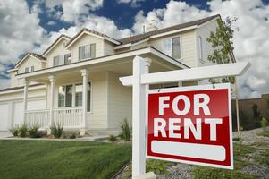 For Rent Real Estate Sign in Front of House photo