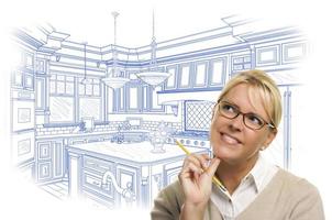 Woman With Pencil Over Custom Kitchen Design Drawing photo