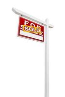 Left Facing Sold For Sale Real Estate Sign Isolated on a White Background. photo