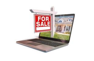 For Sale Real Estate Sign Popping Out of Computer Laptop Screen Isolated on a White Background. photo