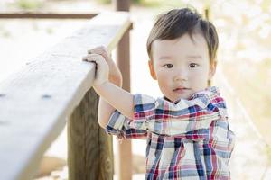 Mixed Race Young Boy Having Fun Outside photo