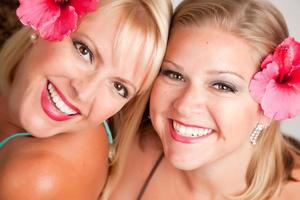 Beautiful Smiling Girls with Hibiscus Flowers photo