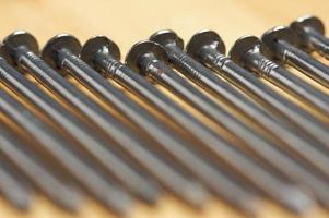 Macro of Nails on Wood photo