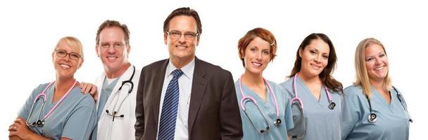 Friendly Male and Female Doctors with Businessman on White photo