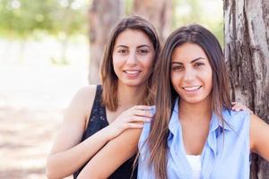 Two Beautiful Ethnic Twin Sisters Portrait Outdoors. photo
