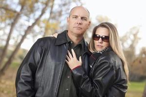 Attractive Couple in Park with Leather Jackets photo