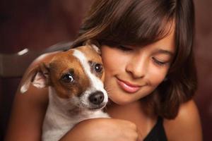 Pretty Hispanic Girl and Her Puppy Studio Portrait photo