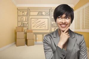 Mixed Race Female In Room With Drawing of Entertainment Unit photo