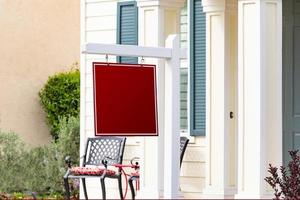 Blank Sale Real Estate Sign in Front of House photo