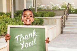 Hispanic Boy Holding Thank You Chalk Board on School Campus photo