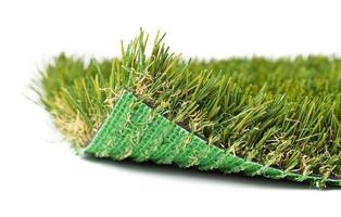 Flipped Up Section of Artificial Turf Grass On White Background photo