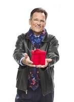 Man Wearing Black Leather Jacket Holding Christmas Gift on White photo