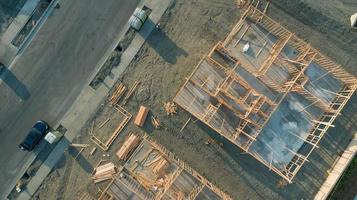 Drone Aerial View of Home Construction Site Foundations and Framing photo