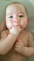 Adorable Chinese and Caucasian Baby Boy Playing Getting A Bath photo