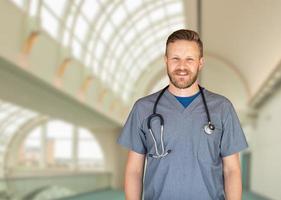 Caucasian Male Nurse Inside Hospital Building photo