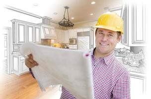 Contractor Holding Blueprints Over Custom Kitchen Drawing and Photo