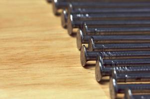 Macro of Nails on Wood photo