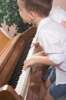 Children Playing the Piano photo