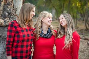 Beautiful Mother and Young Adult Daughters Portrait Outdoors photo