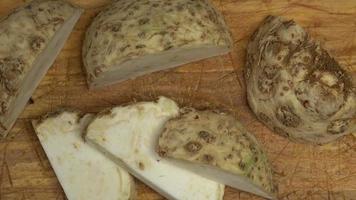 Fresh celery root on a wooden board video