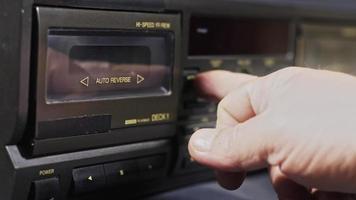 A Human Hand Puts A Cassette On The Old-Fashioned Cassette Player And Presses The Play Button video