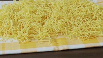 Dry homemade soup noodles. Raw small noodles. video